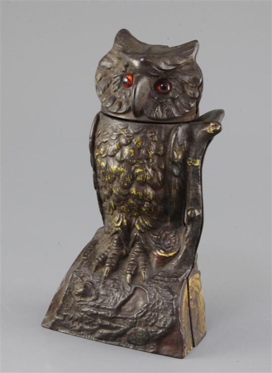 A late 19th century cast iron owl money bank, c.1880, 7.5in.